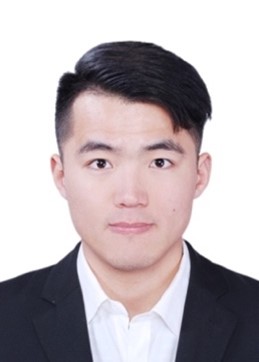 A person wearing a suit and tie smiling at the camera

Description automatically generated